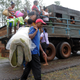 People who had to evacuate the area return to their homes in the Carbonera community of Guantanamo, Cuba following Hurricane Matthew, October 5, 2016. The storm slammed into Haiti and Cuba as a Category Four hurricane on October 4, 2016 but has since been downgraded to three, on a scale of five, by the US National Hurricane Center (NHC). Its winds were howling at 115 miles per hour. (Image: Getty)